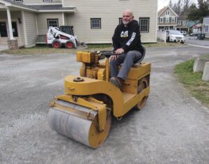 Raymond Hayes of Caputo Excavating works on the parking lot of the Catskill Veterans' Outreach Center